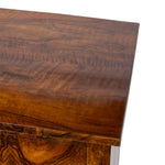 Close-up of a richly grained dark brown wood side table, showing the polished tabletop and wood grain against a white background.