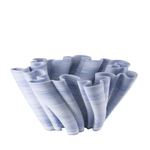 Wave-like ceramic vase on a white background