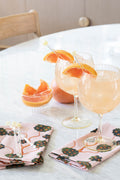 orange grove napkins with cocktails