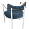 white chair with brass details and blue upholstered seat
