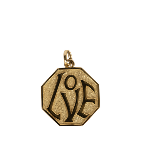 gold charm with "love" design