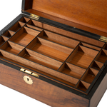 Wooden jewelry box with compartments on a white background