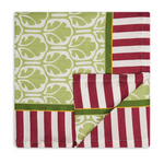 Tablecloth with green pattern and red and white striped trim