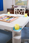 game table with backgammon set and yellow glasses