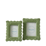 Two green wicker frames on white background