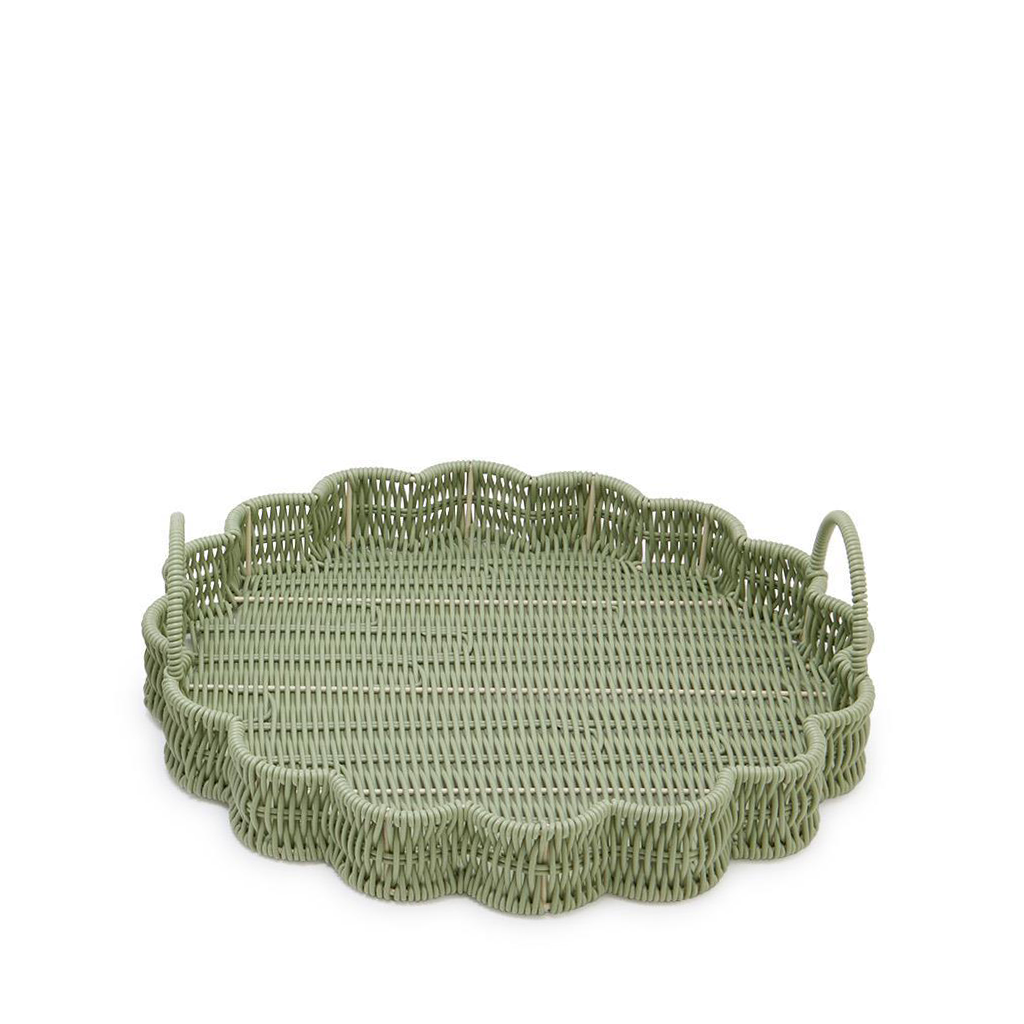 Green woven tray with scalloped edges on a white background