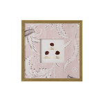 Framed artwork with floral pattern on a white background
