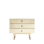 Beige dresser with gold accents on a white background