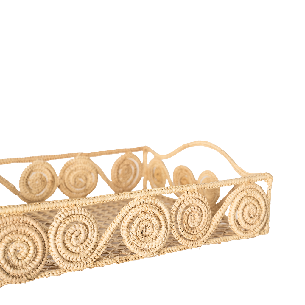 Decorative woven basket with spiral patterns on a white background