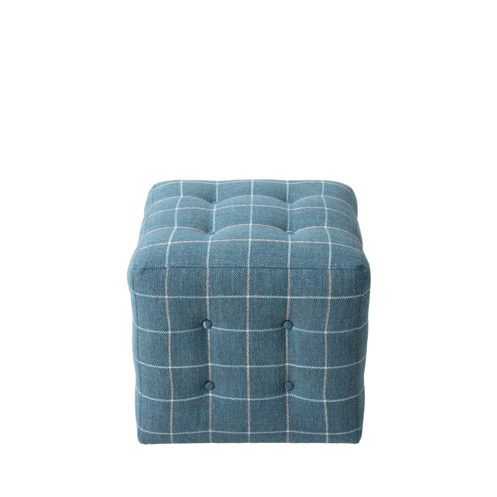 Blue checkered ottoman on a white background