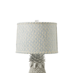 Pineapple-shaped lamp with a patterned shade on a white background