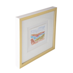 A framed abstract landscape art print with a white mat and a gold frame, shown at an angle against a white background.
