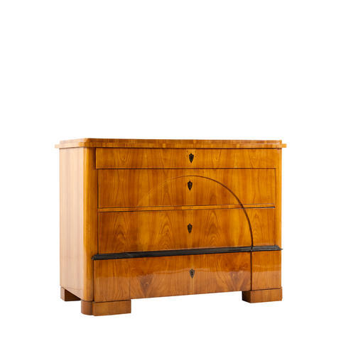 Lois Chest. A wooden chest with 4 drawers in total. It has one thin top drawer and 3 more below. It also has a black stripe right above the last bottom drawer