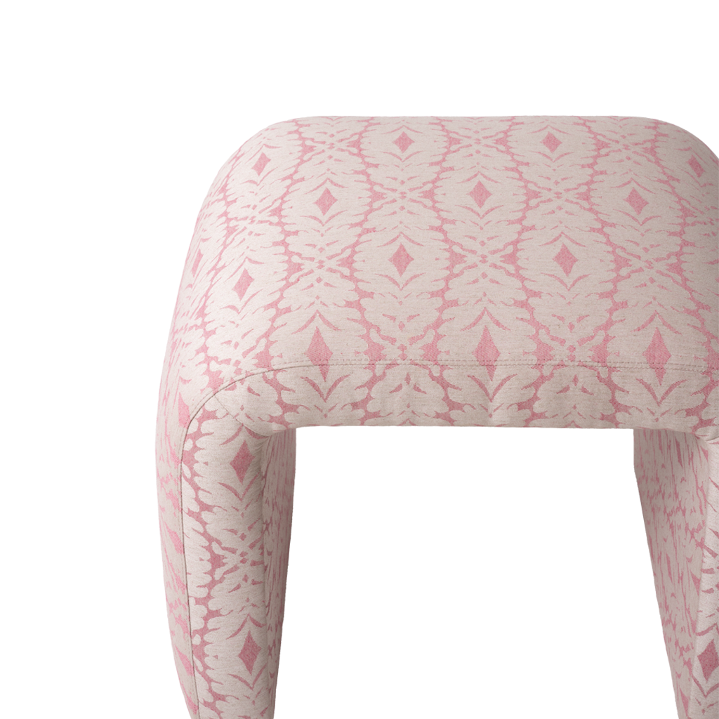 Close up of pink patterned upholstered bench