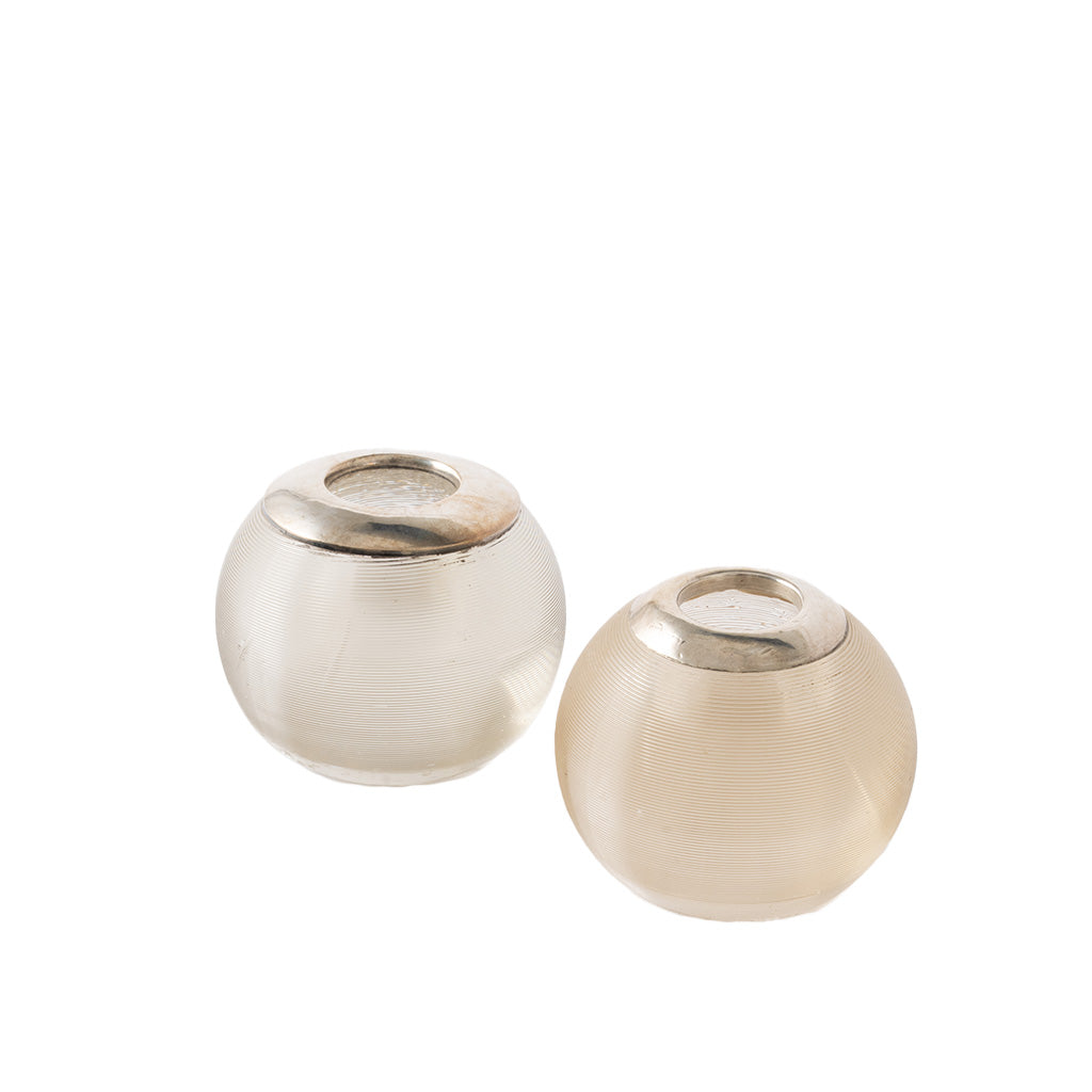 Two small round glass match holders with textured frosted bodies and metallic silver rims, shown on a plain white background.