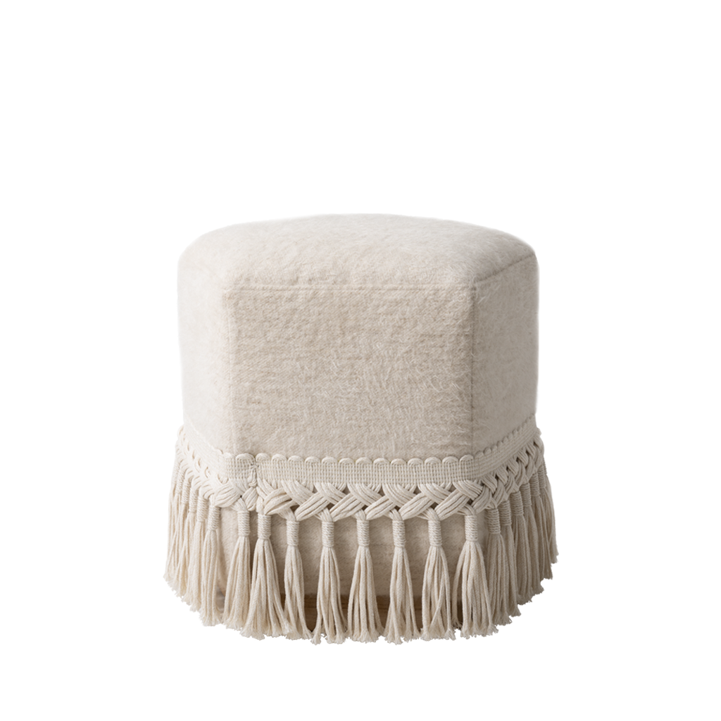 Beige ottoman with macrame fringe on a white background