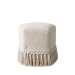Beige ottoman with macrame fringe on a white background