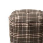 Plaid-patterned ottoman on a white background
