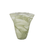 Green glass vase with swirling pattern on a white background