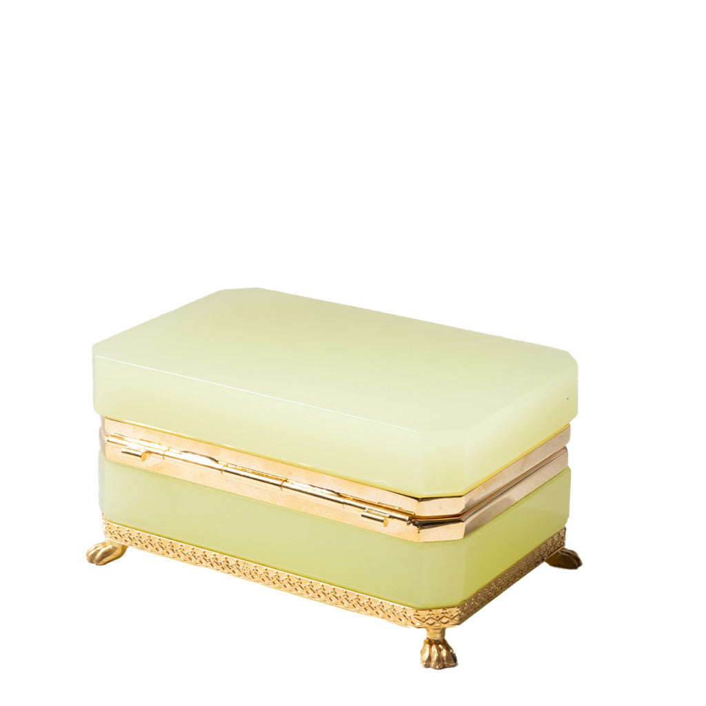 Light green jewelry box with gold accents on a white background