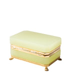 Light green jewelry box with gold accents on a white background