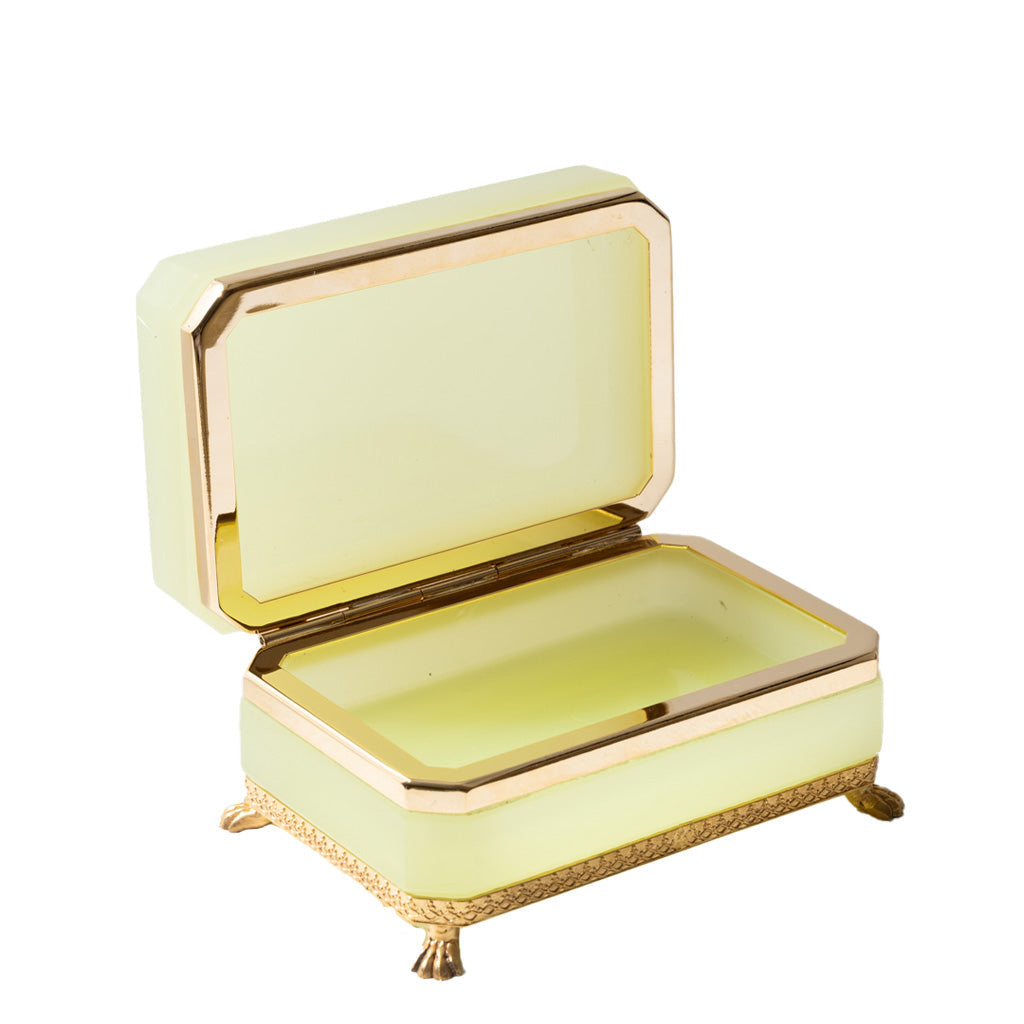 Decorative box with gold accents on a white background