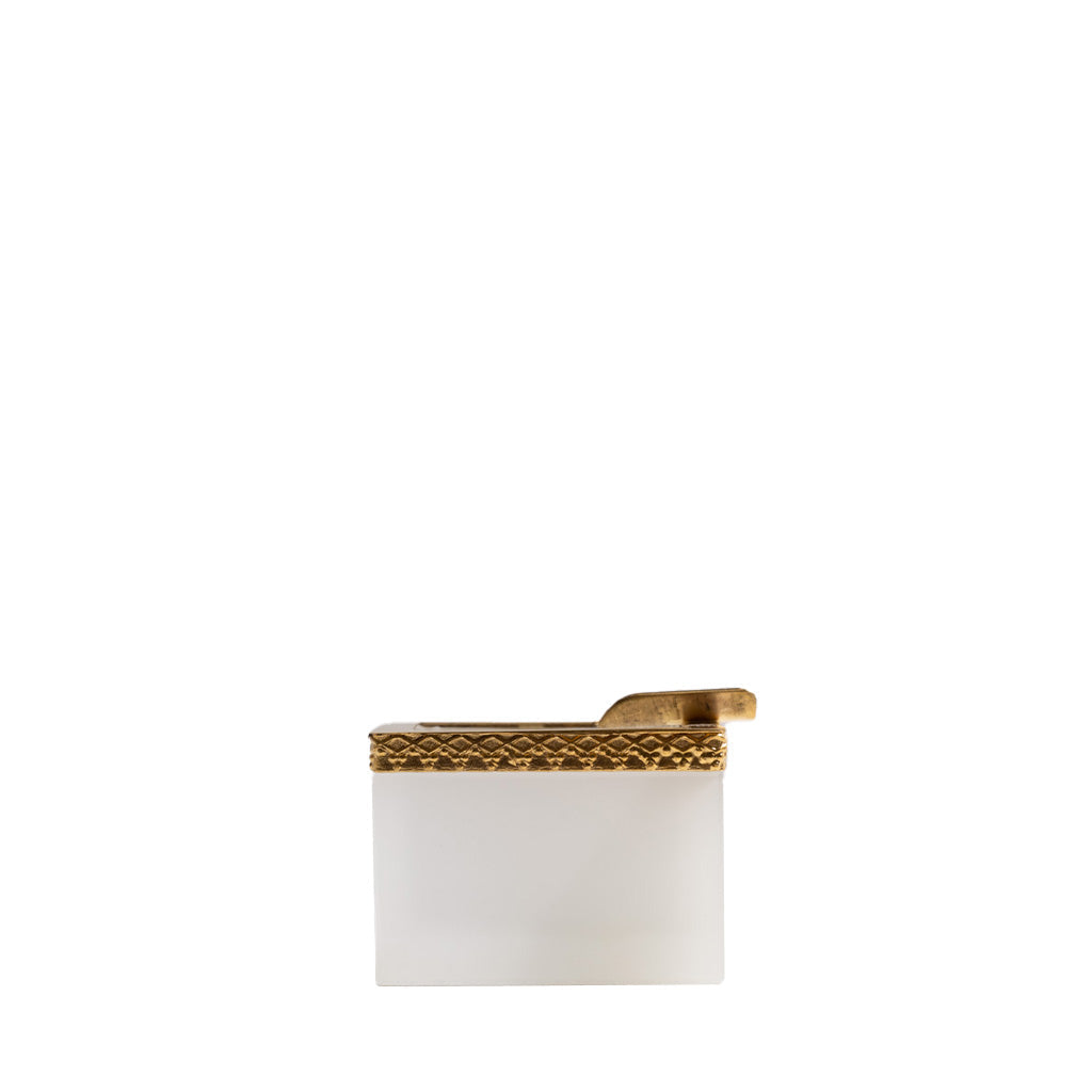 White lighter with gold trim on a white background