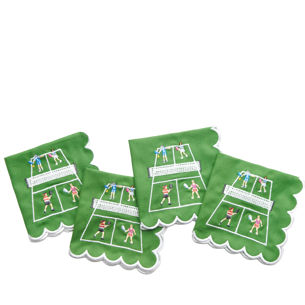Four green square napkins with scalloped edges, printed with a tennis court and player design, arranged on a white background.