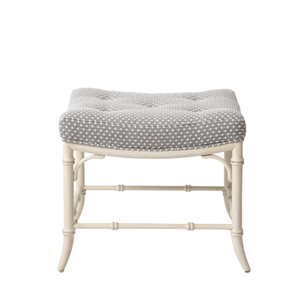 Stool with patterned cushion on a white background