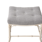 Square white bench with gray and white fabric cushion