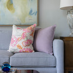 sofa with plum and lavender harlequin pillow