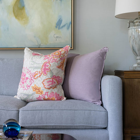 sofa with plum and lavender harlequin pillow