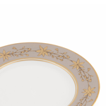 Decorative plate with gold floral patterns on a white background