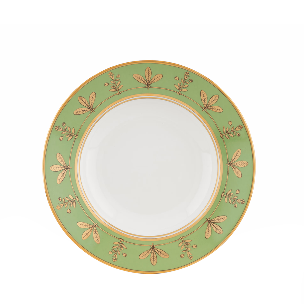 Green ceramic plate with gold floral patterns on a white background