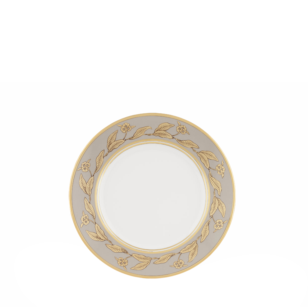 Decorative plate with gold floral pattern on a white background