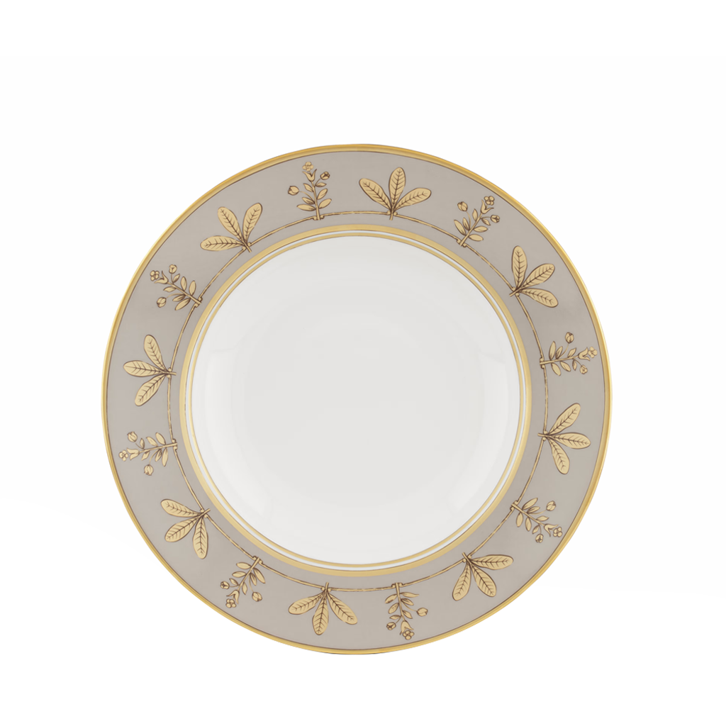 Decorative plate with gold leaf pattern on a white background