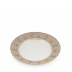 Decorative plate with gold leaf pattern on a white background