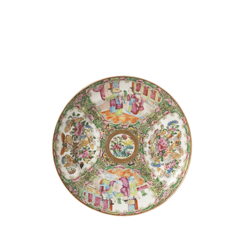 Decorative plate with intricate patterns on a white background