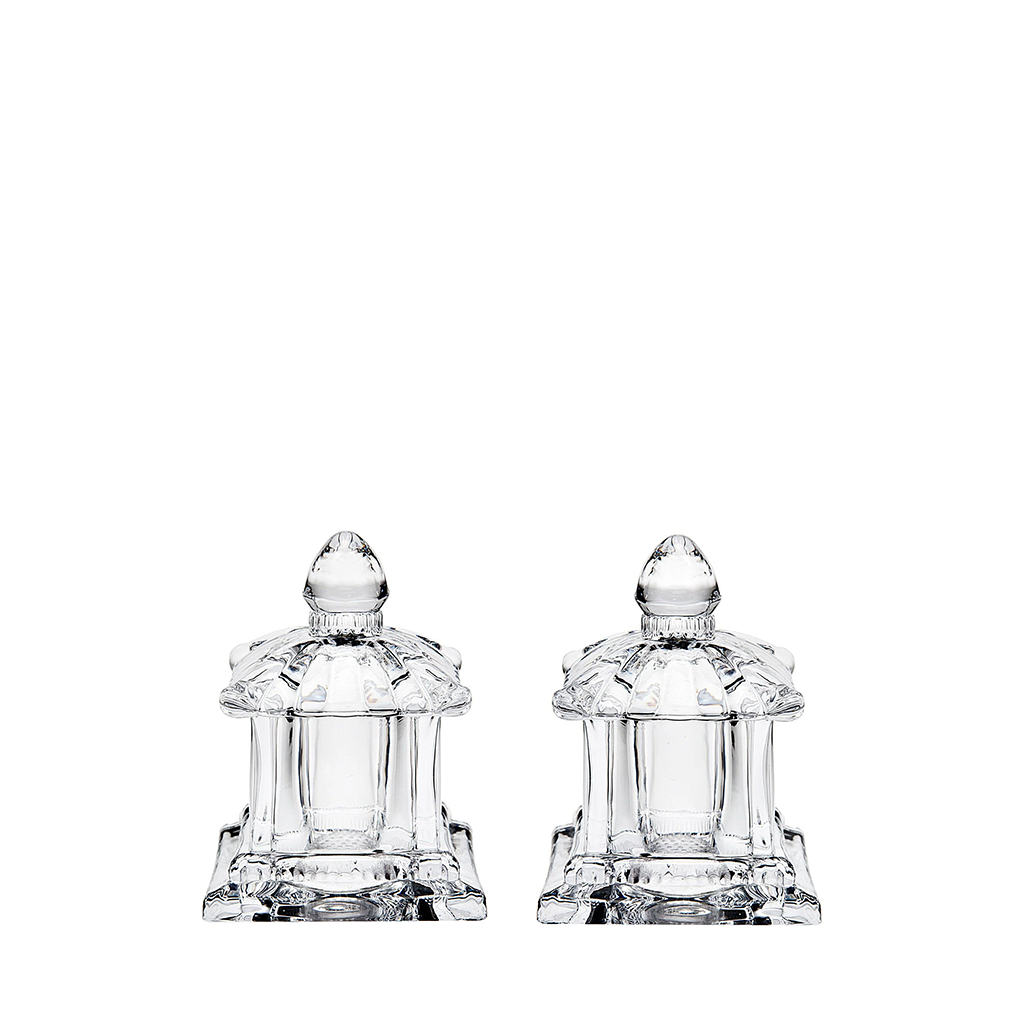 Two clear crystal salt and pepper shakers on a white background