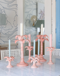 variety of pink palm candlestick sizes being used 