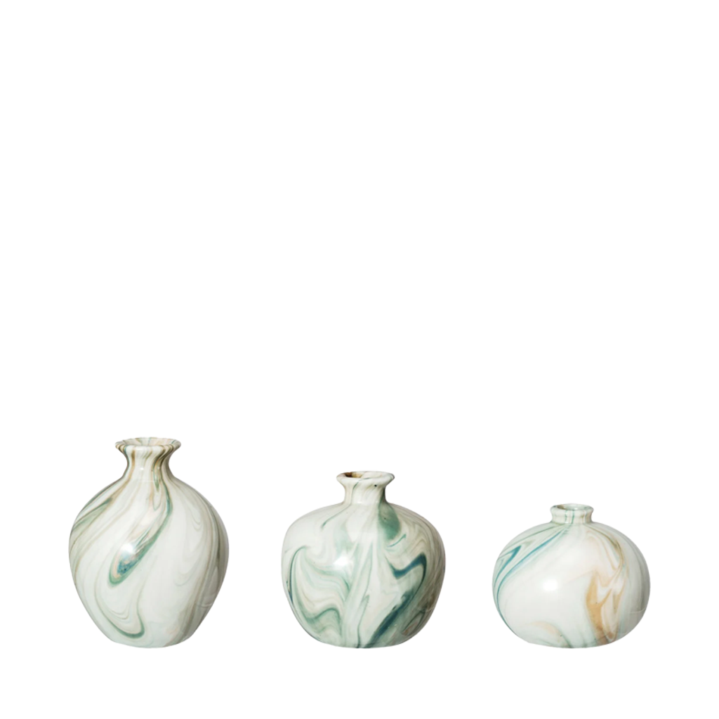 Three marbled ceramic vases on a white background