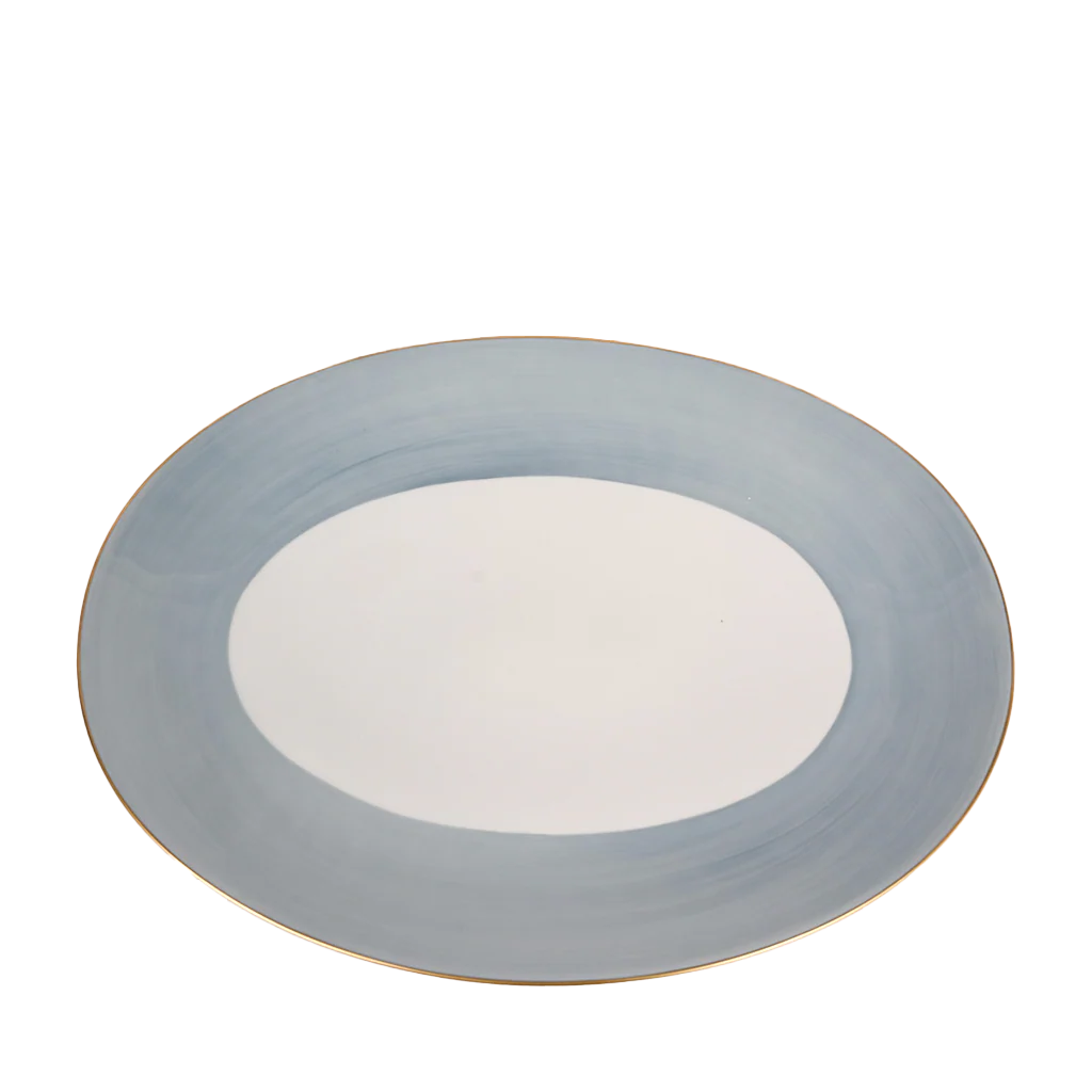 Round ceramic plate with a light blue rim on a white background