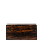 A rectangular wooden storage box with a dark brown and black zebra wood grain pattern, featuring a small round metal lock on the front, set against a plain white background.