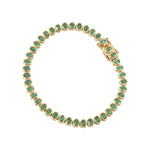 A gold tennis bracelet featuring round-cut green emerald-cut gemstones, displayed on a clean white background.