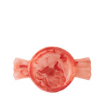 A translucent coral-pink ring with a textured, organic marbled pattern, shown against a solid white background.