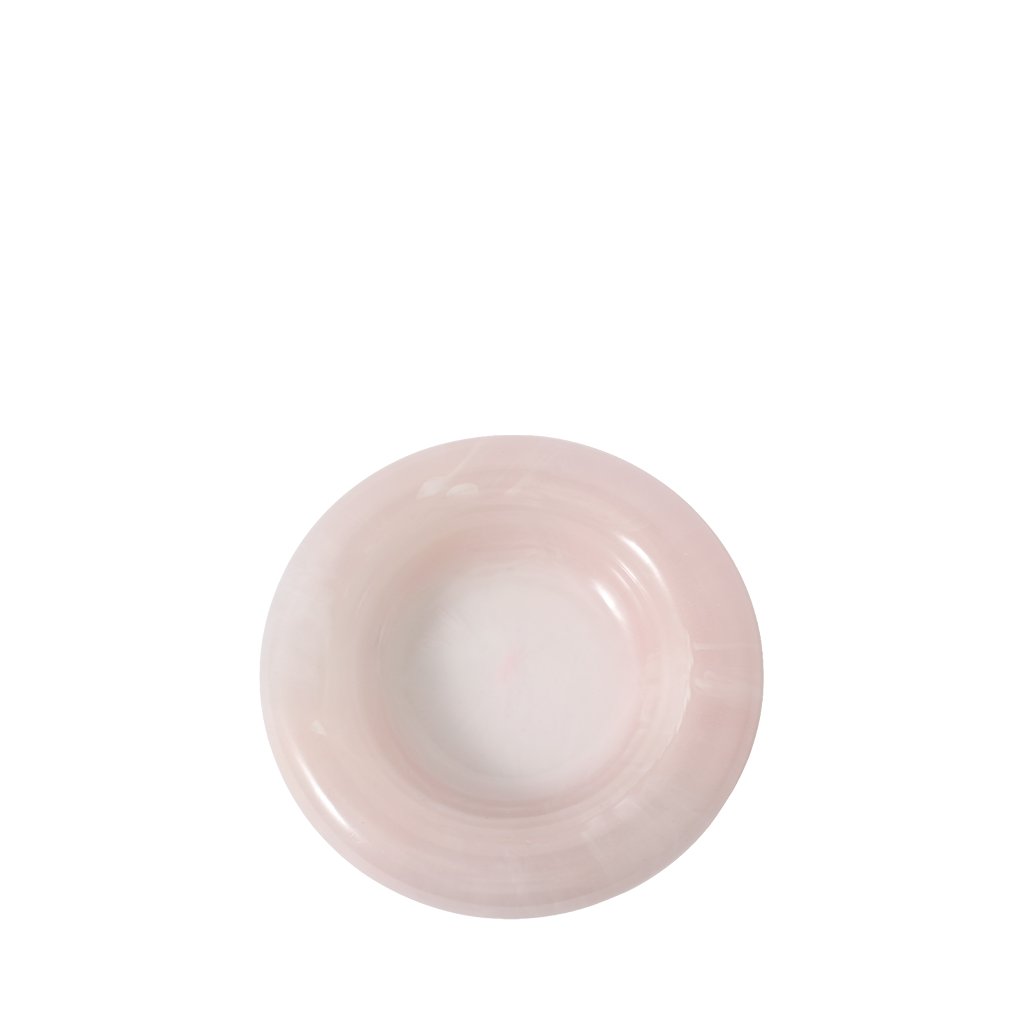 Round pink resin catch all on a white background