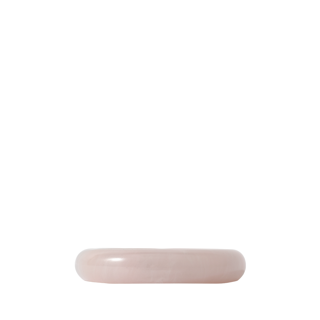 Pink resin object on a white background