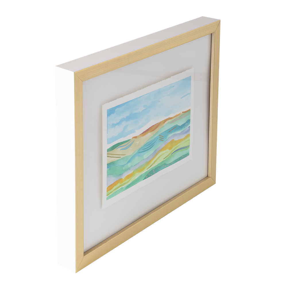 A framed abstract landscape art print with colorful wavy hills in shades of green, yellow, and blue, set in a light natural wood frame with a white mat on a white background.