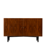 Wooden sideboard with two doors on a white background