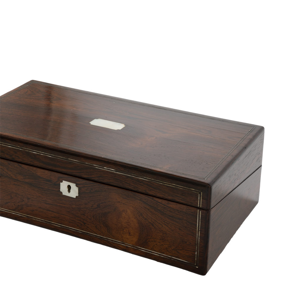 A rectangular dark brown wooden box with a visible wood grain, featuring a small silver metal plaque on the lid and a silver lock on the front panel, set against a plain white background.
